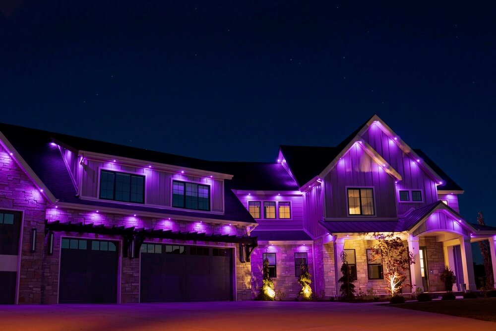 Home with purple JellyFish permanent roofline lights