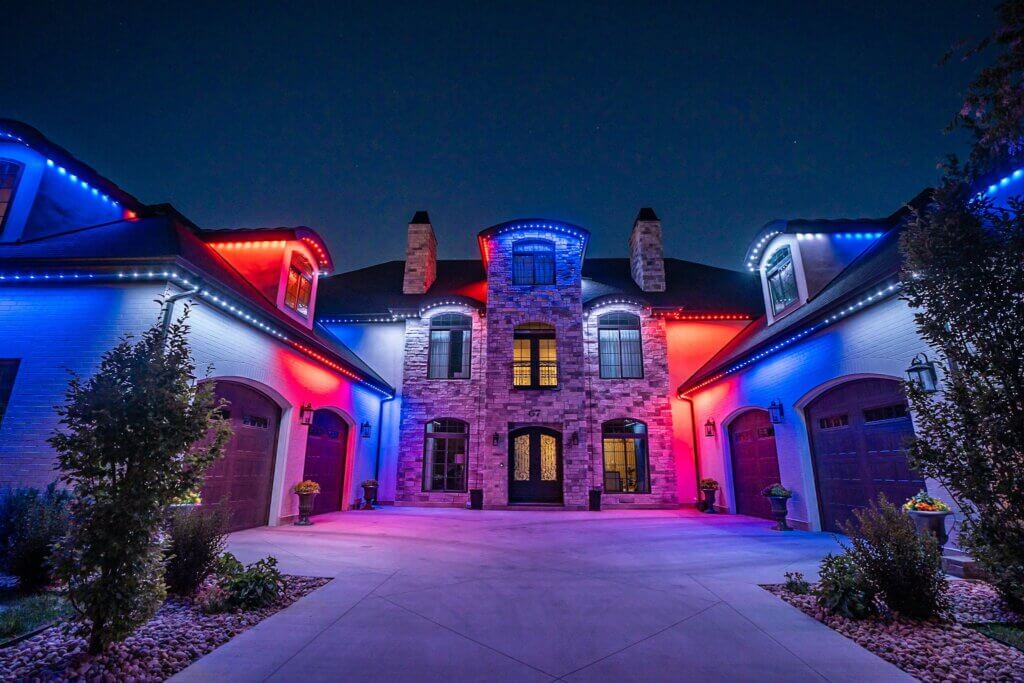 Home with red, white and blue Fourth of July JellyFish permanent lights