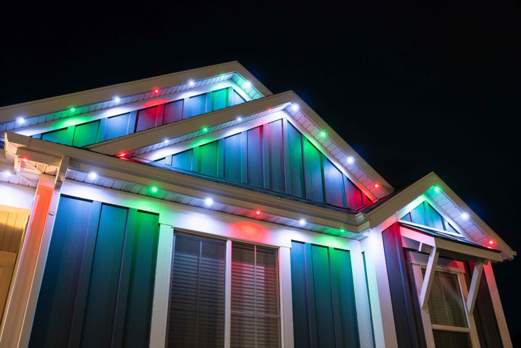 Christmas multicolor roofline closeup with permanent outdoor lighting
