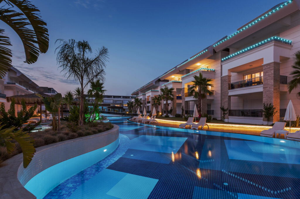 Resort pool area with commercial LED lighting at night